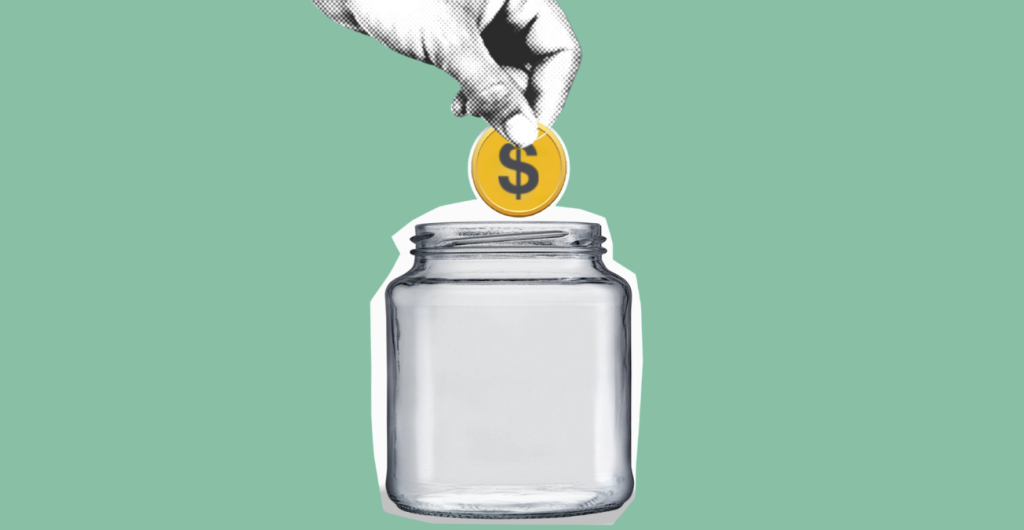 Image of hand putting money into a jar